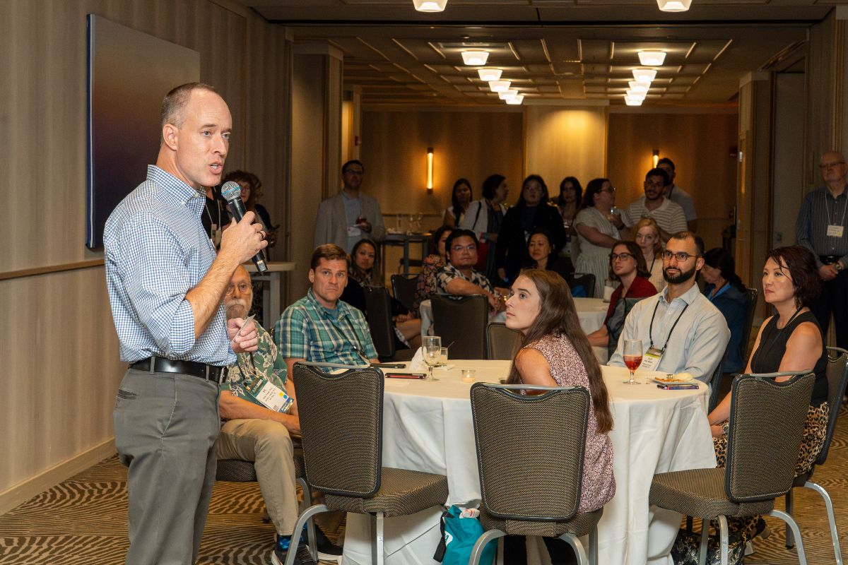 Speaker addressing CSPP alumni and friends at an event